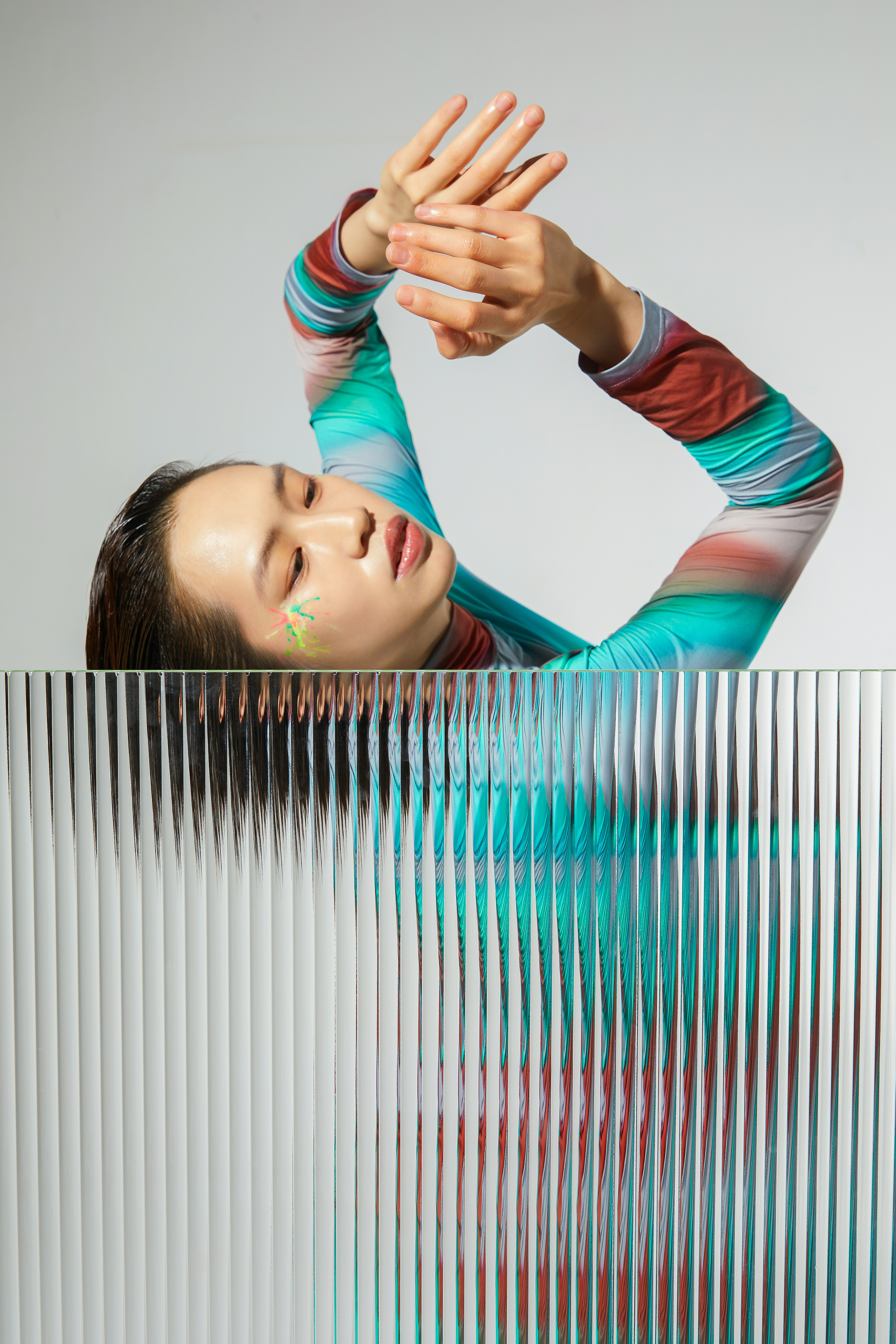 a woman with her hands up in the air