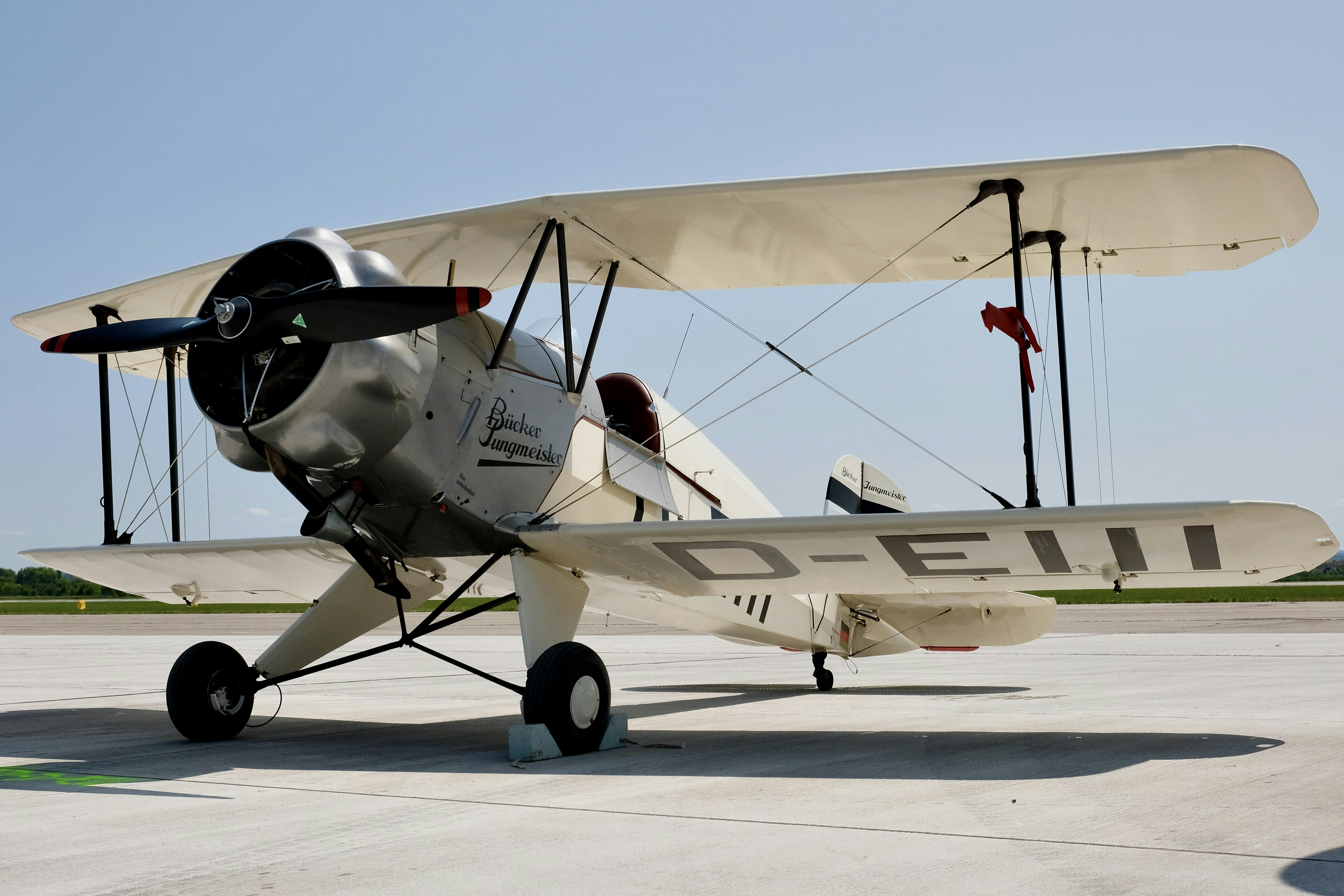 a small airplane sitting on top of an airport tarmac