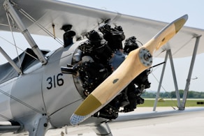 a close up of a propeller plane on a runway