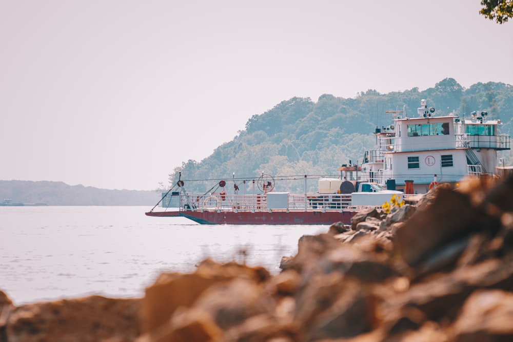 a large boat floating on top of a body of water