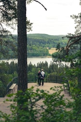 A couple enjoying a scenic guided tour in a lush green landscape.