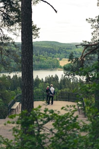 A couple enjoying a scenic guided tour in a lush green landscape.