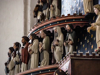 Close-up of intricately carved wooden figures from the famous Tischler-Krippe at Schlossbergplatz.
