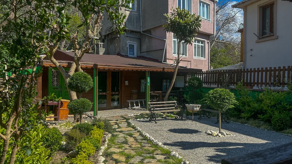 a house with a garden and a patio in front of it