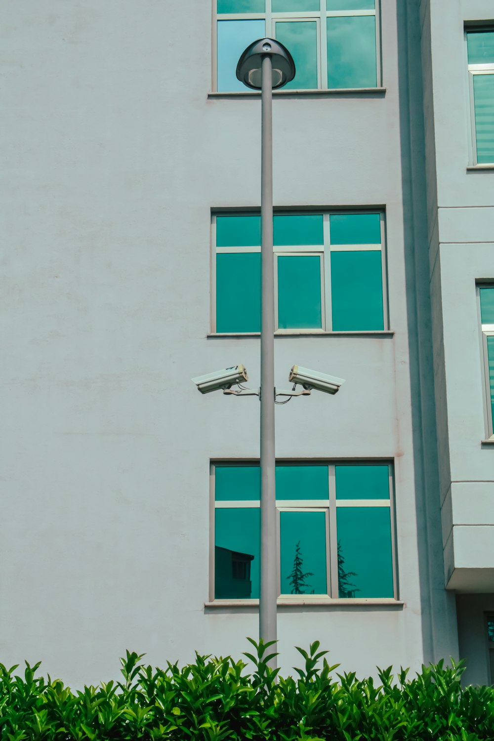 a street light in front of a tall building