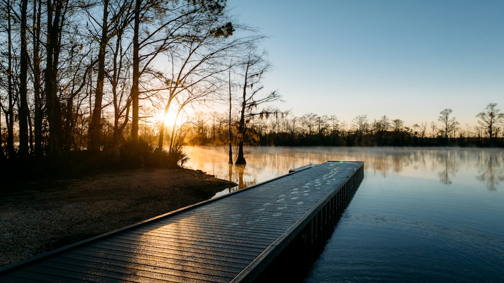 a wooden dock sitting next to a body of water