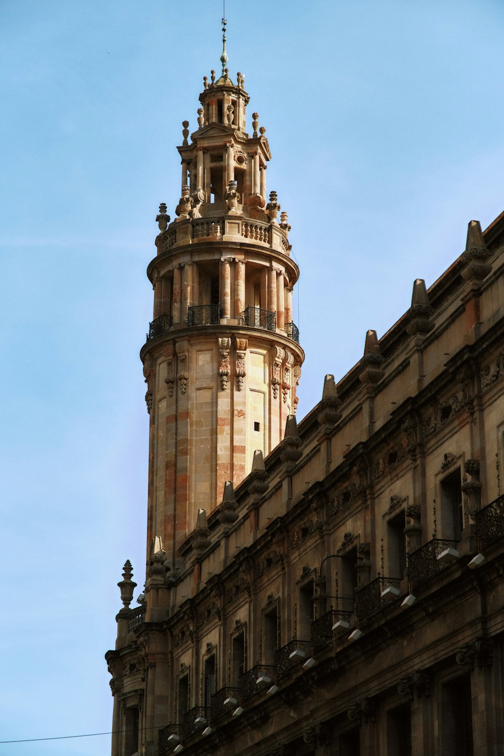 a tall building with a clock on the top of it