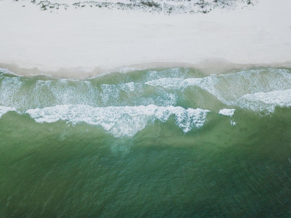 an aerial view of a beach and ocean