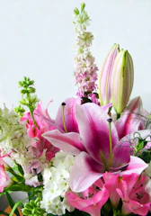 A vase filled with pink and white flowers