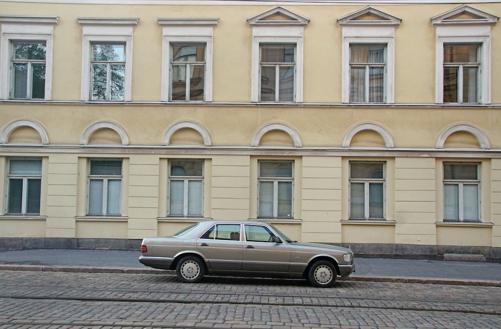 a car is parked in front of a building