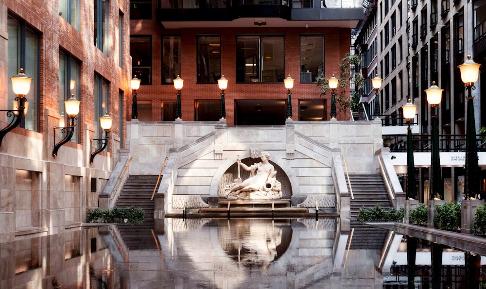 a building with a fountain in the middle of it