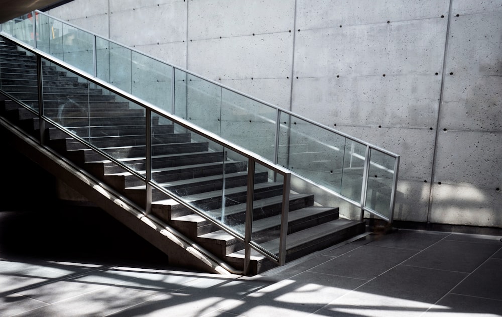 a set of stairs next to a concrete wall