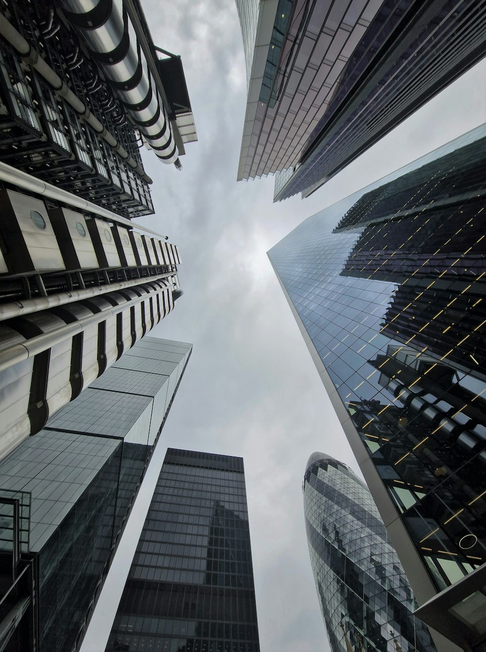 looking up at skyscrapers in a city