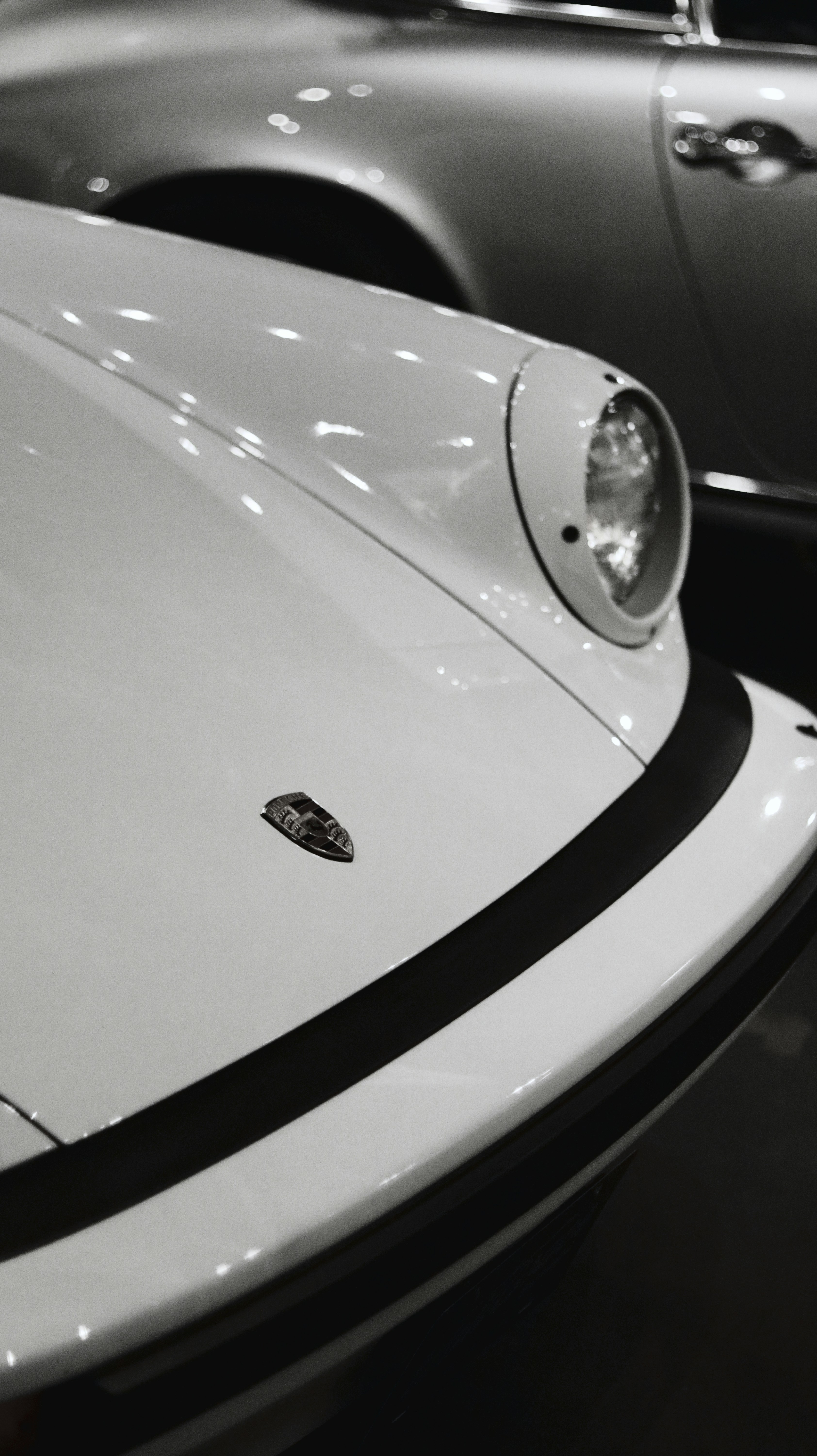 a black and white photo of two cars