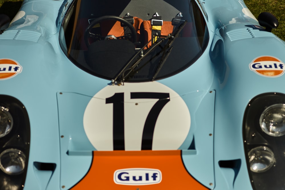 the front of a blue race car with a number 17 on it