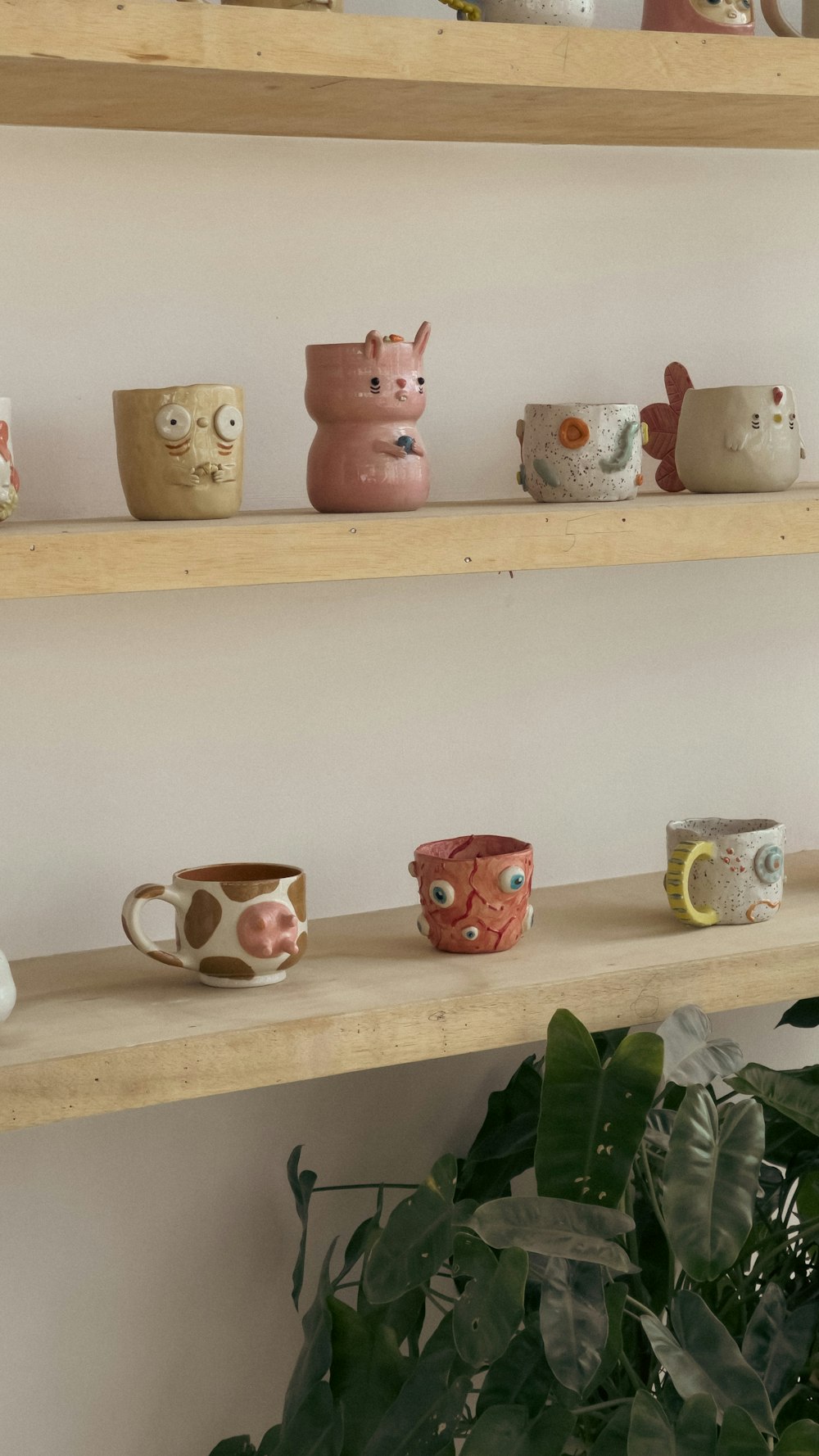 a shelf filled with lots of different kinds of cups