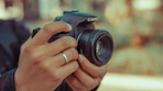 a person holding a camera in their hands