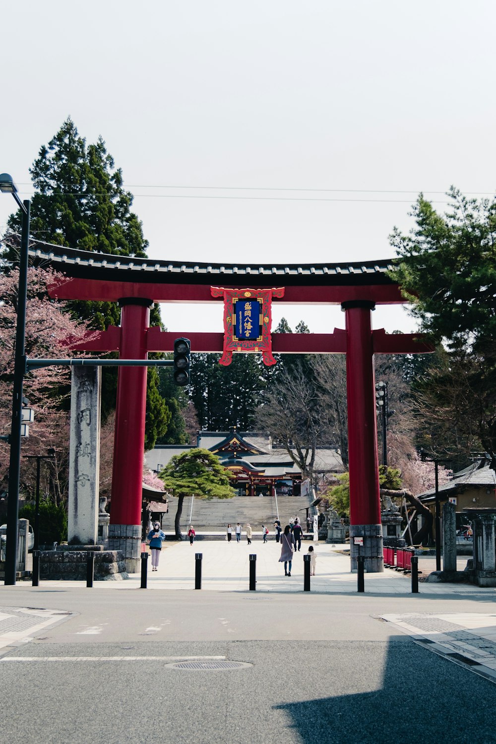 a large red arch with a clock on it