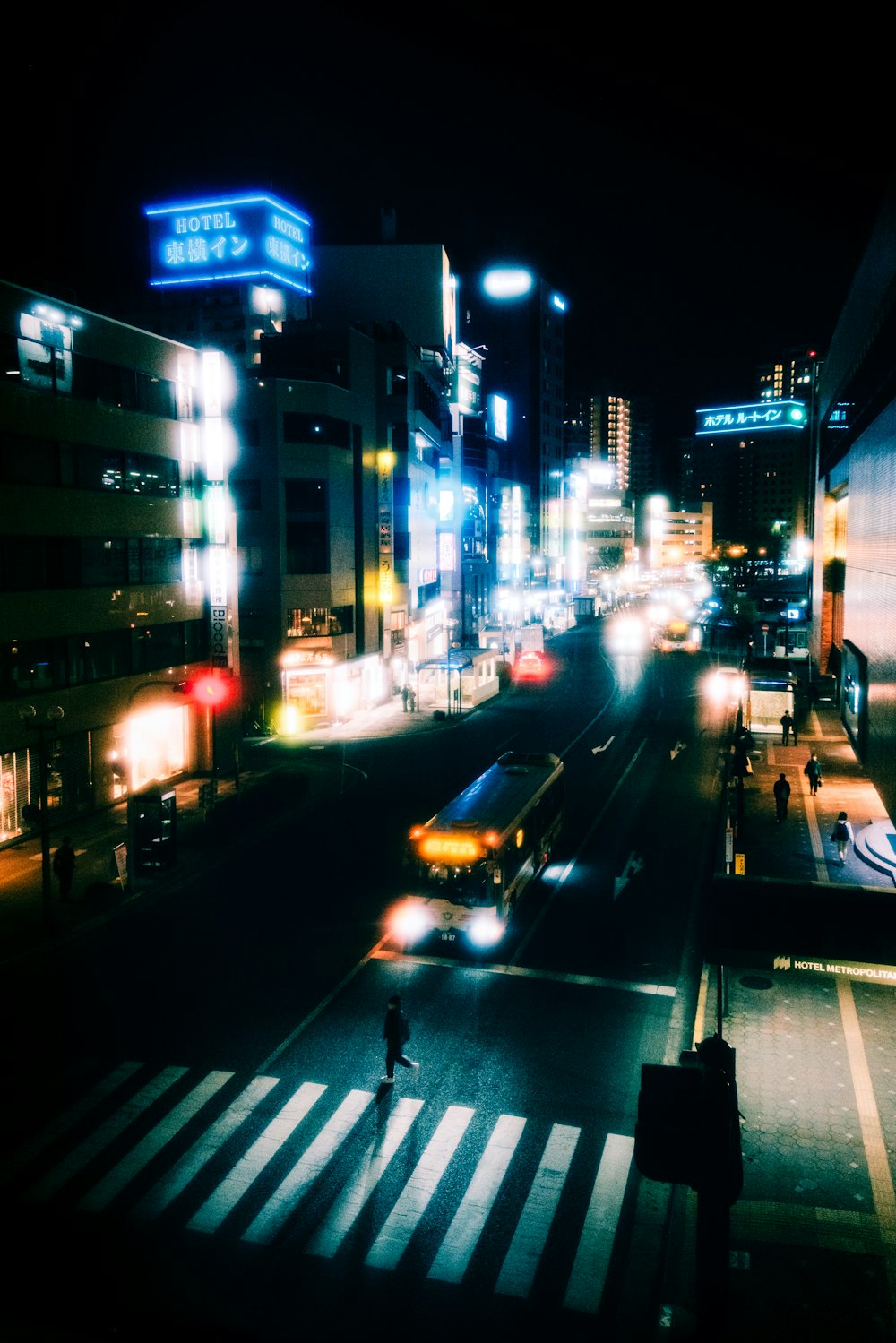 a busy city street at night with a lot of traffic