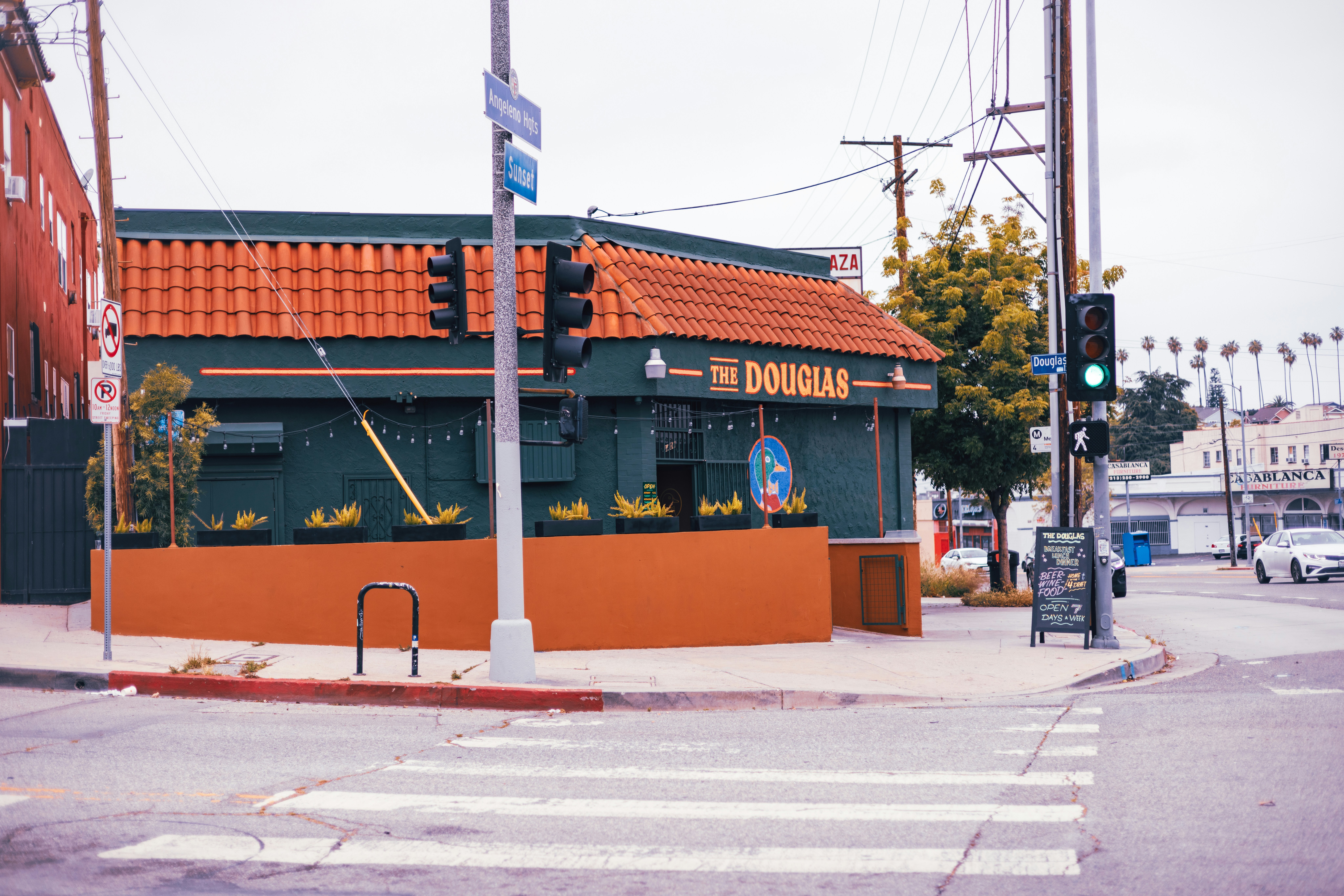a street corner with a building and a traffic light, 