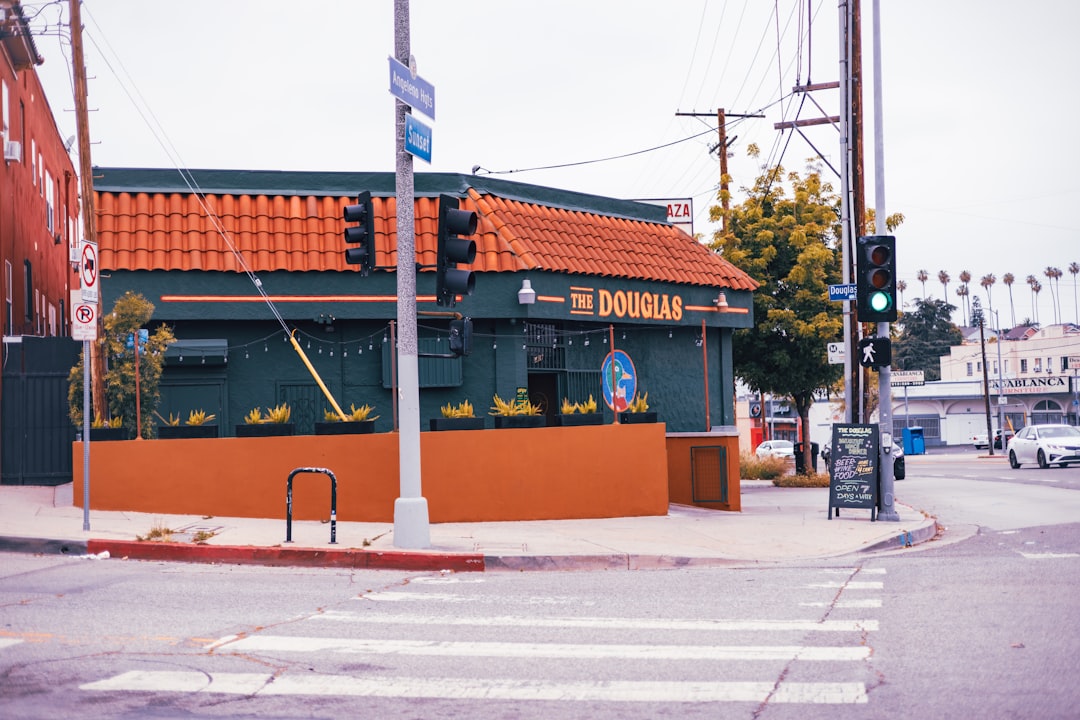 a street corner with a building and a traffic light,