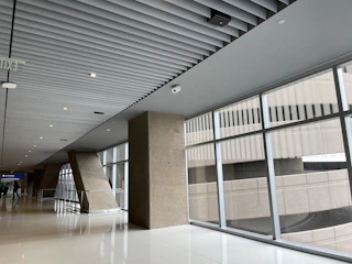 Bright LED luminaires installed in a commercial hallway.