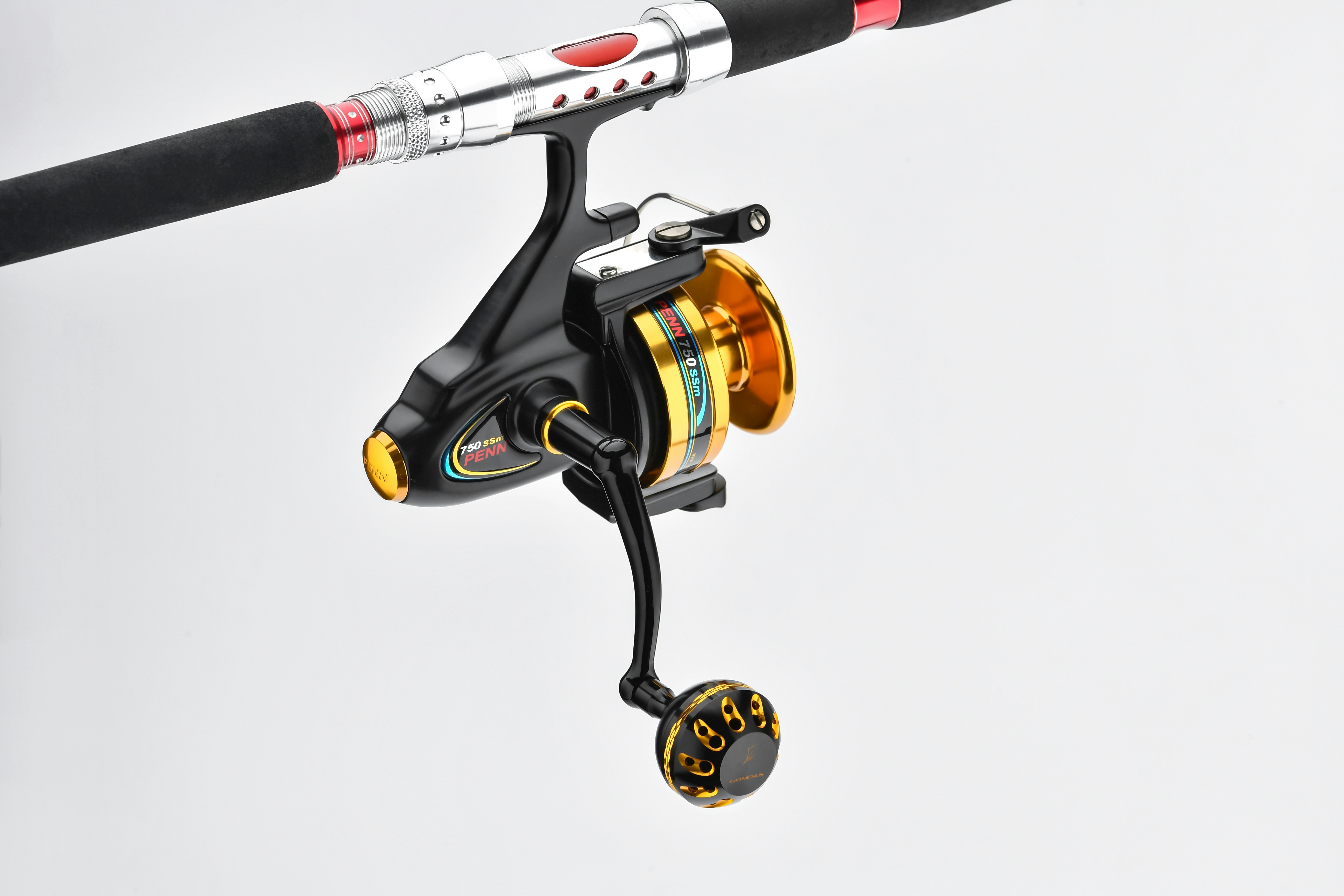 a fishing rod and reel attached to a fishing pole