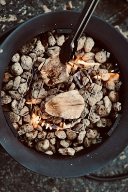 Close-up of a sizzling Afro-Caribbean seafood platter fresh off the grill, steam rising invitingly.