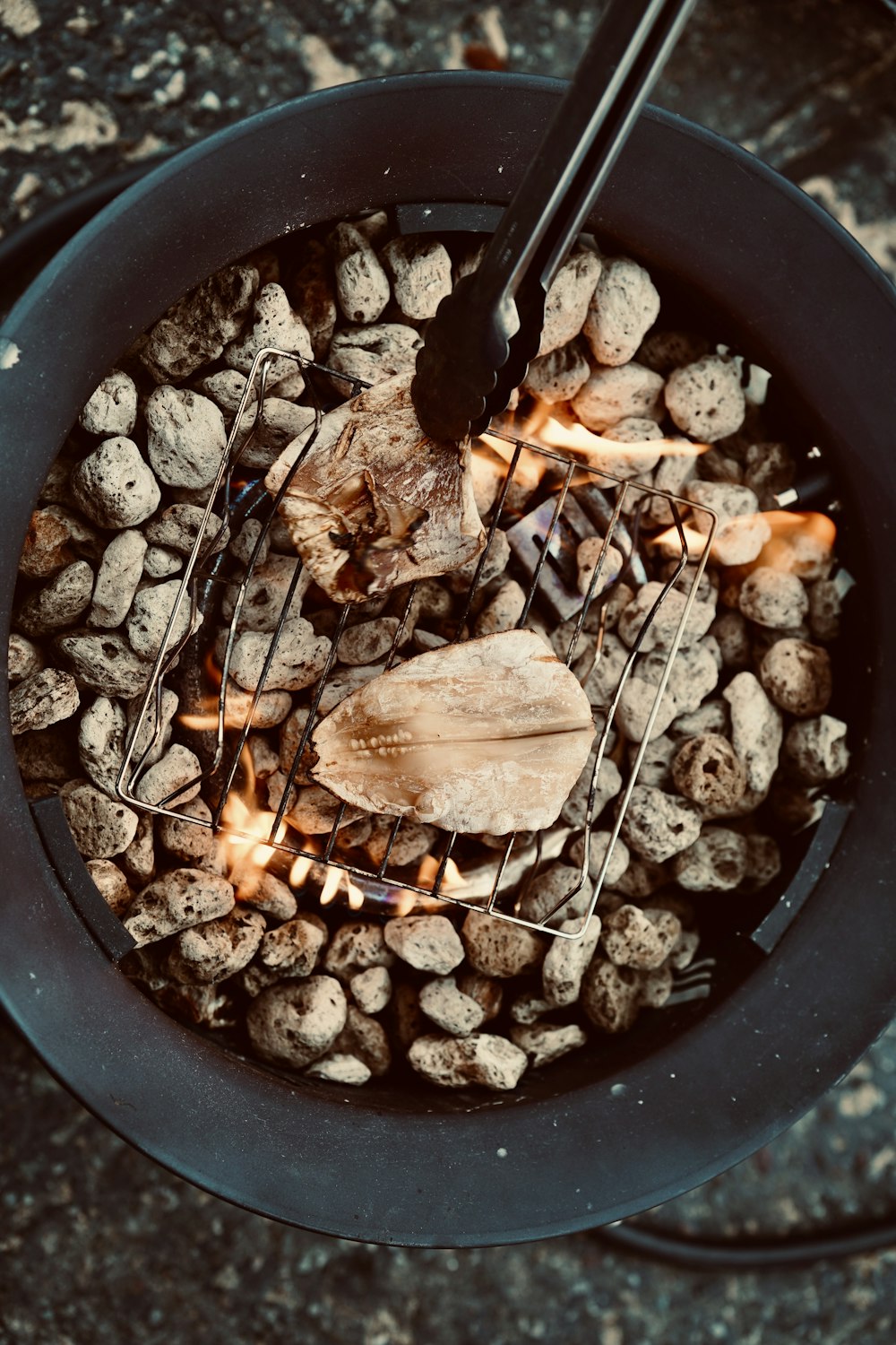 a bowl filled with rocks and a wooden spoon