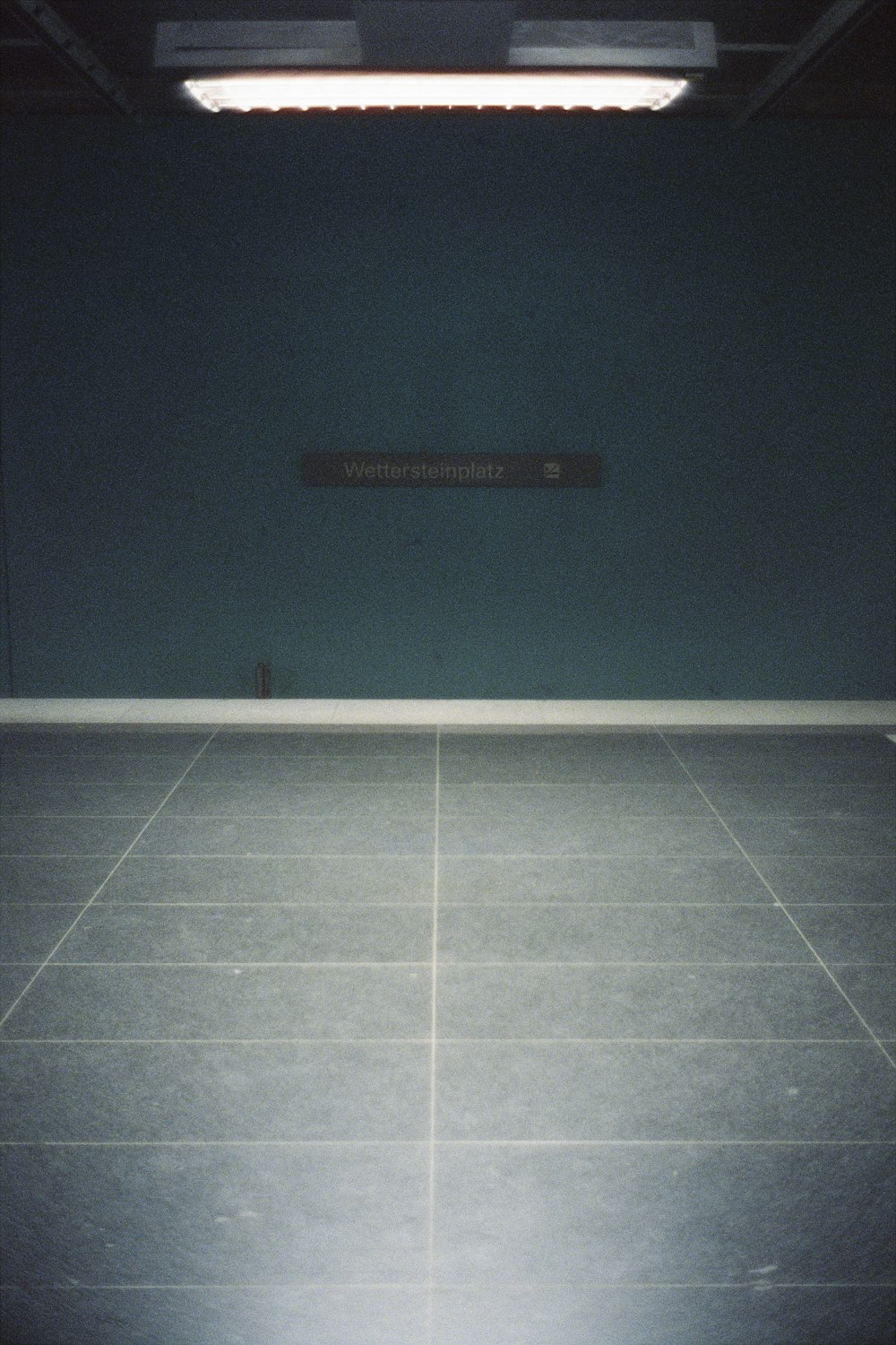 an empty room with a sign on the wall