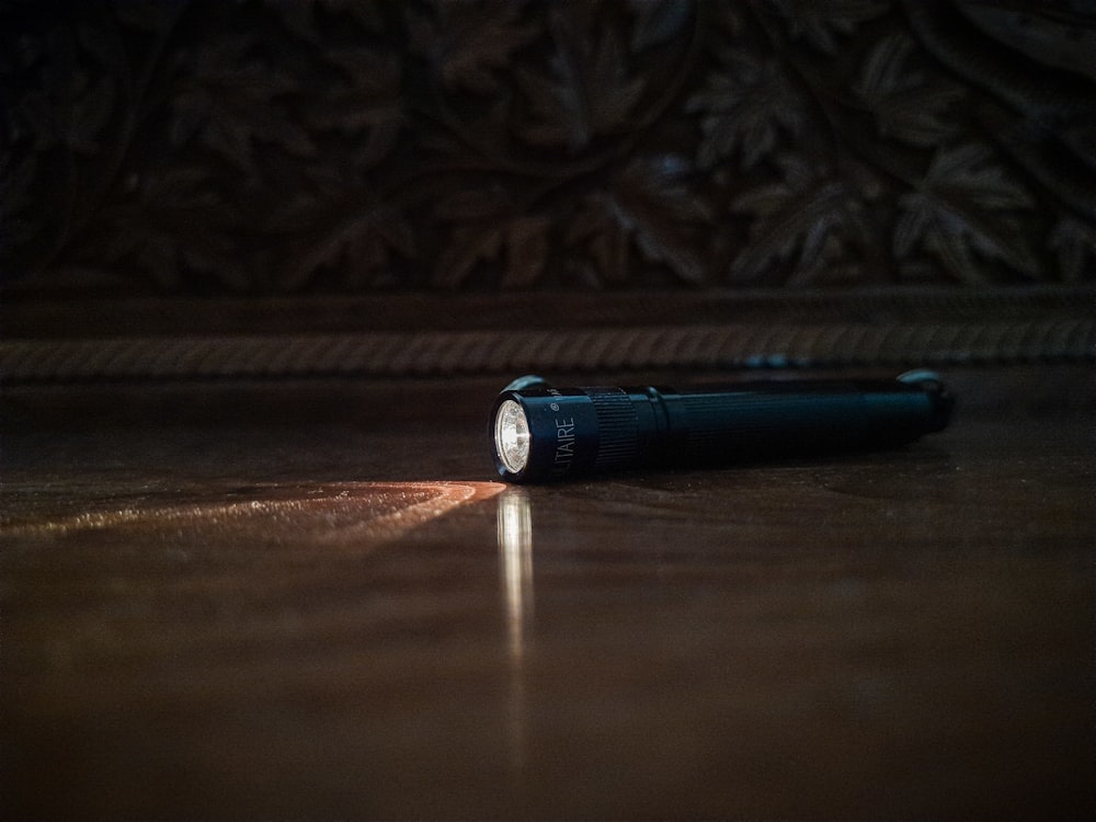 a flashlight sitting on the floor of a room