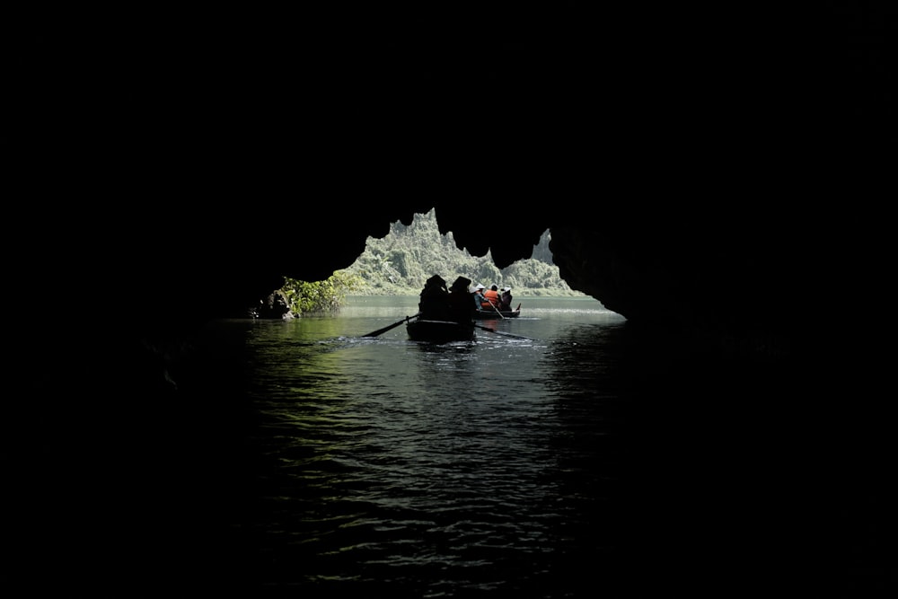 a group of people in a boat in the water