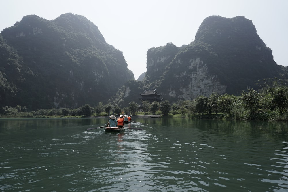 a couple of people in a small boat on a river
