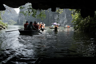 a group of people in a boat on a river