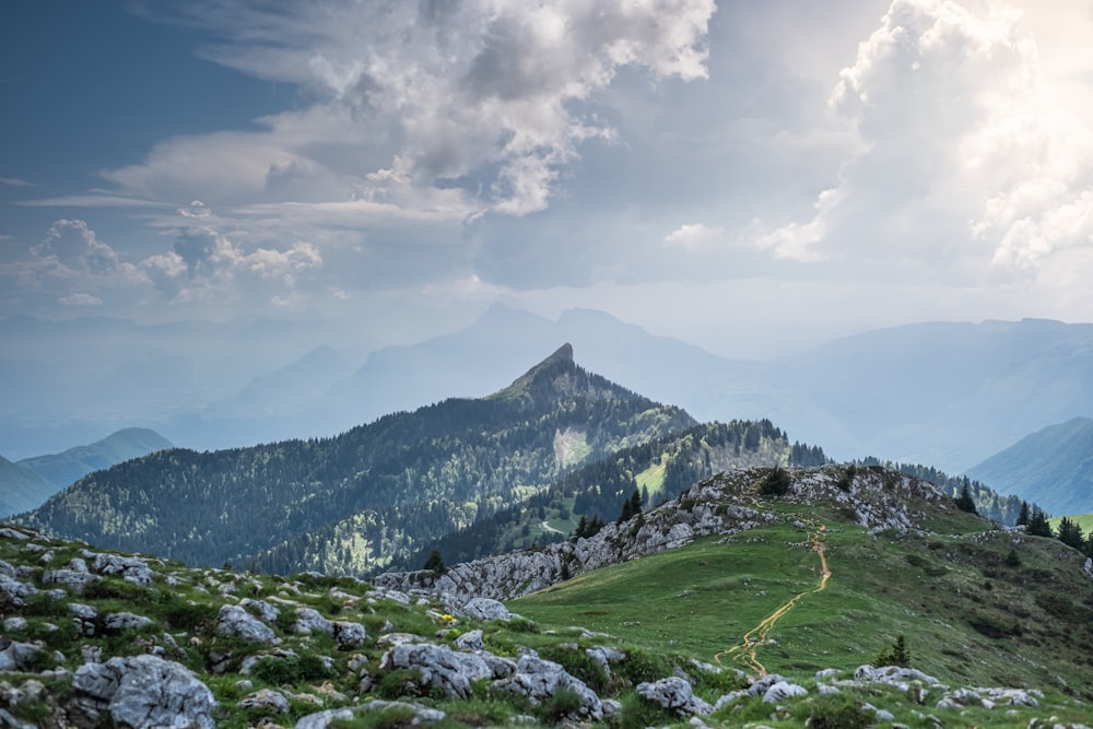 a view of a mountain with a trail going up the side of it