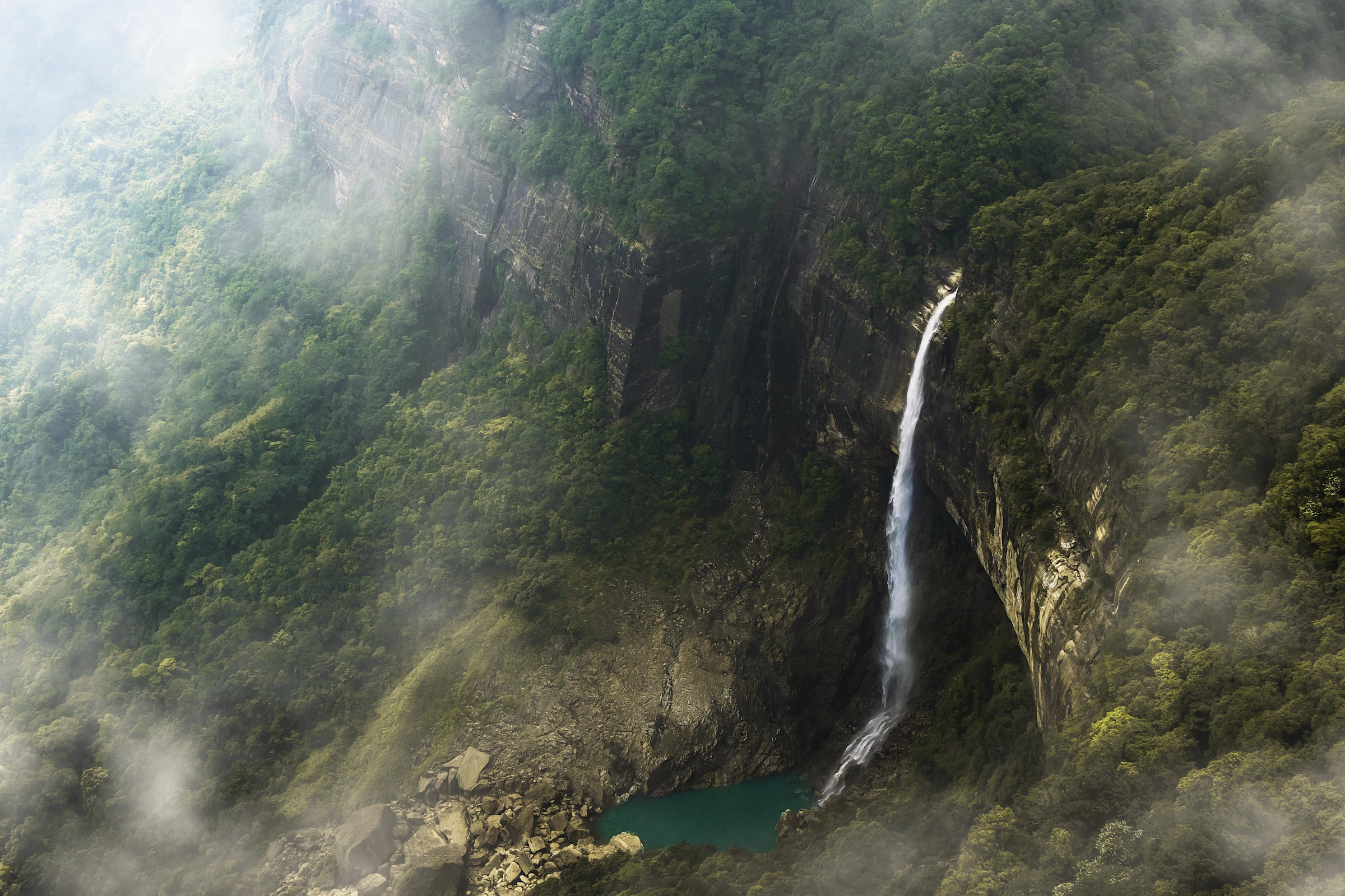 A monsoon waterfall plunging through the cliffs of Meghalaya