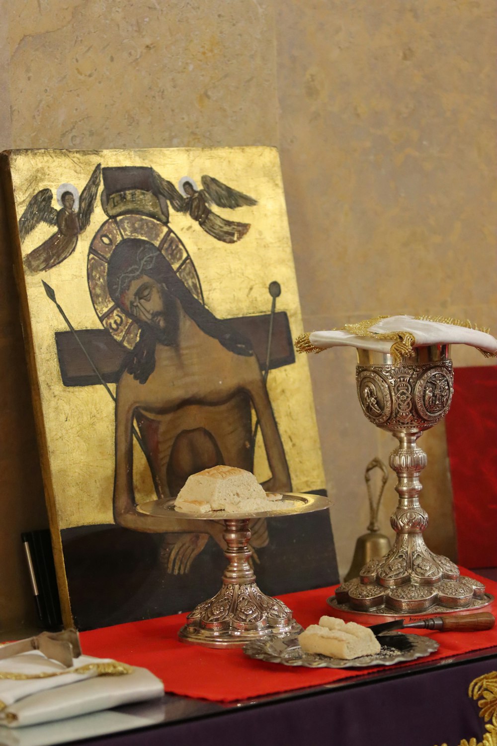 a painting of a woman holding a dove on a table