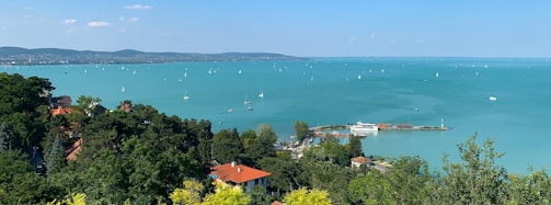 A panoramic view of Bear Lake with yachts lined up, ready for a friendly race.