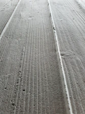 Close-up of smooth, freshly poured concrete surface ready for finishing.