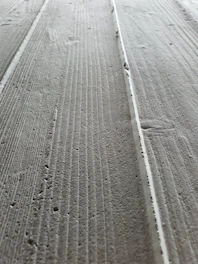 Close-up of smooth, freshly poured concrete surface.