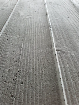 Close-up of smooth, freshly poured concrete surface.