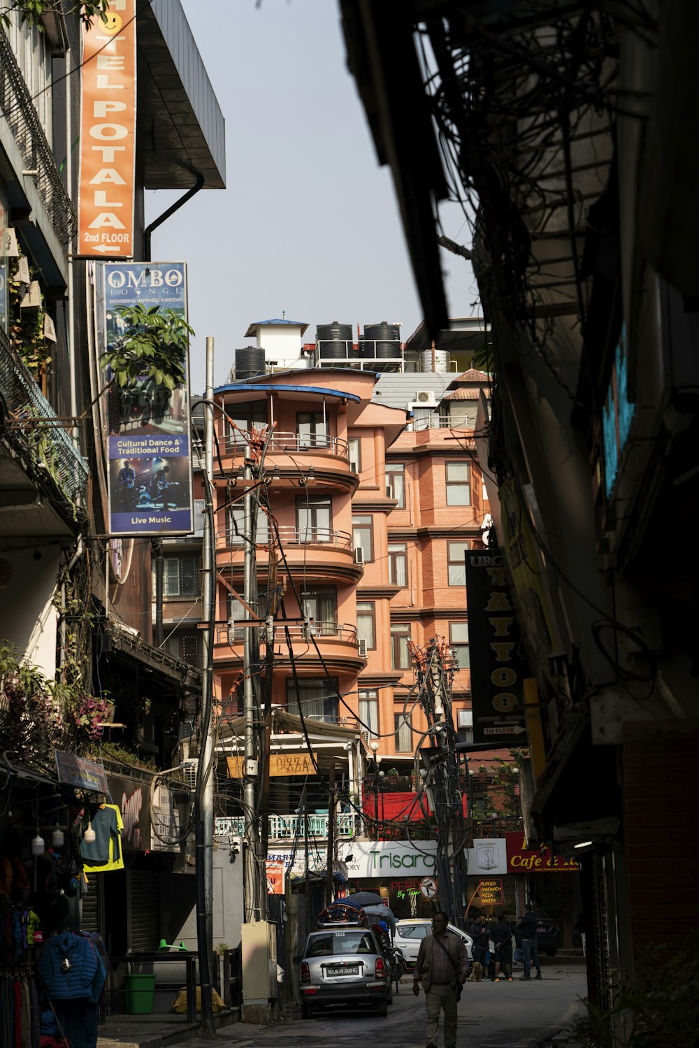 a city street filled with lots of tall buildings