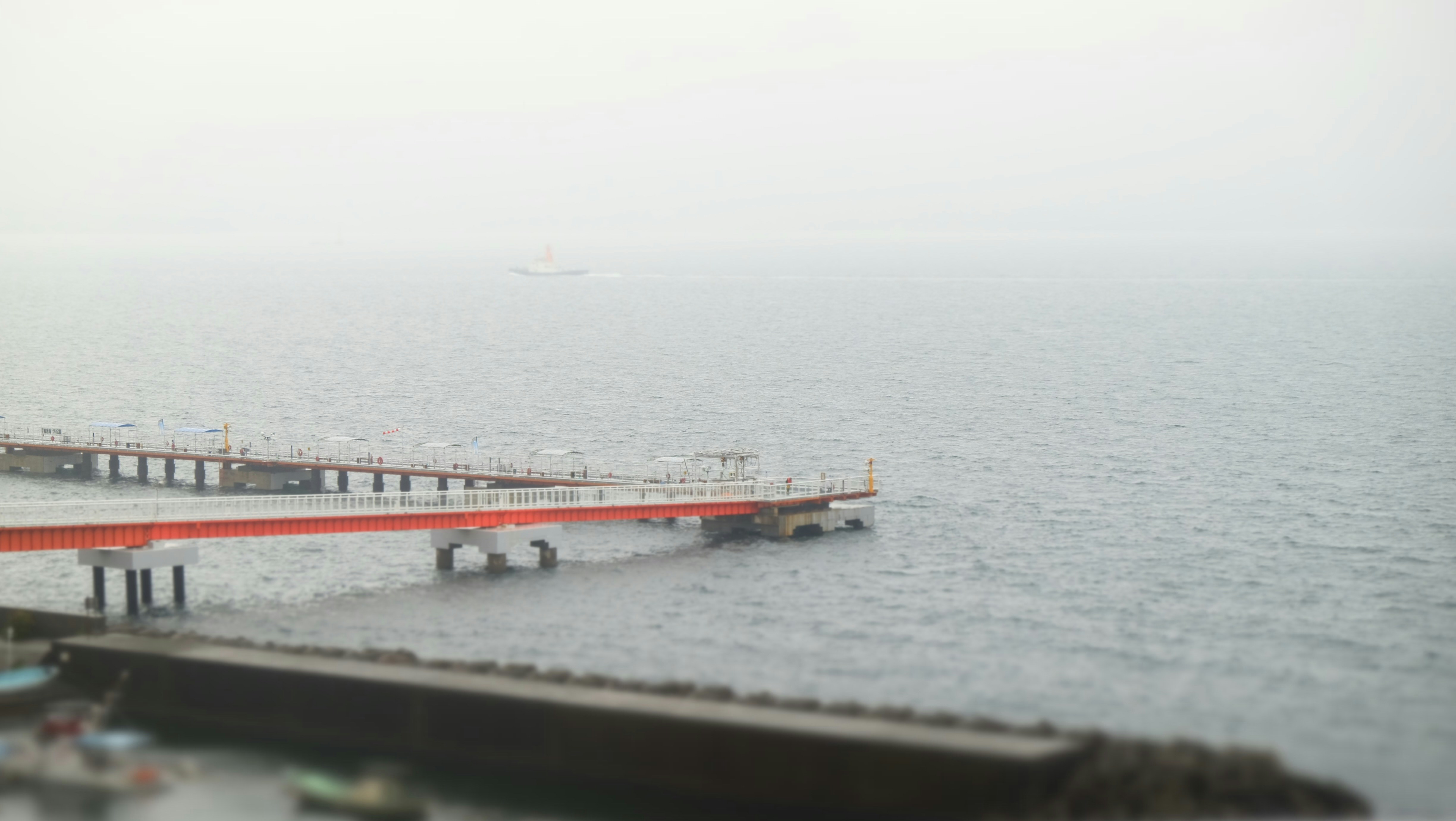 a pier in the middle of a body of water