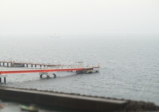 a pier in the middle of a body of water