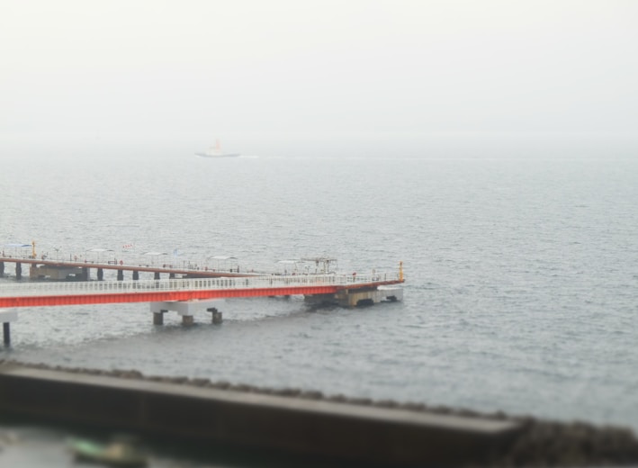 a pier in the middle of a body of water