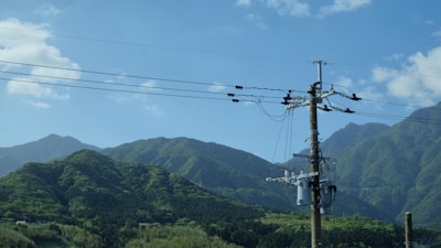 a telephone pole with a lot of wires on top of it