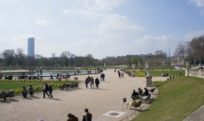 Tourists enjoying a sunny day at South Bank Parklands with lush greenery and water features