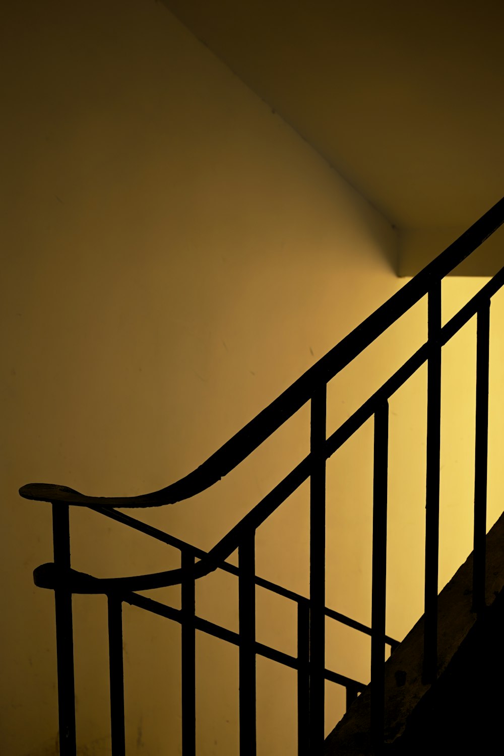 a black and white photo of a stair rail