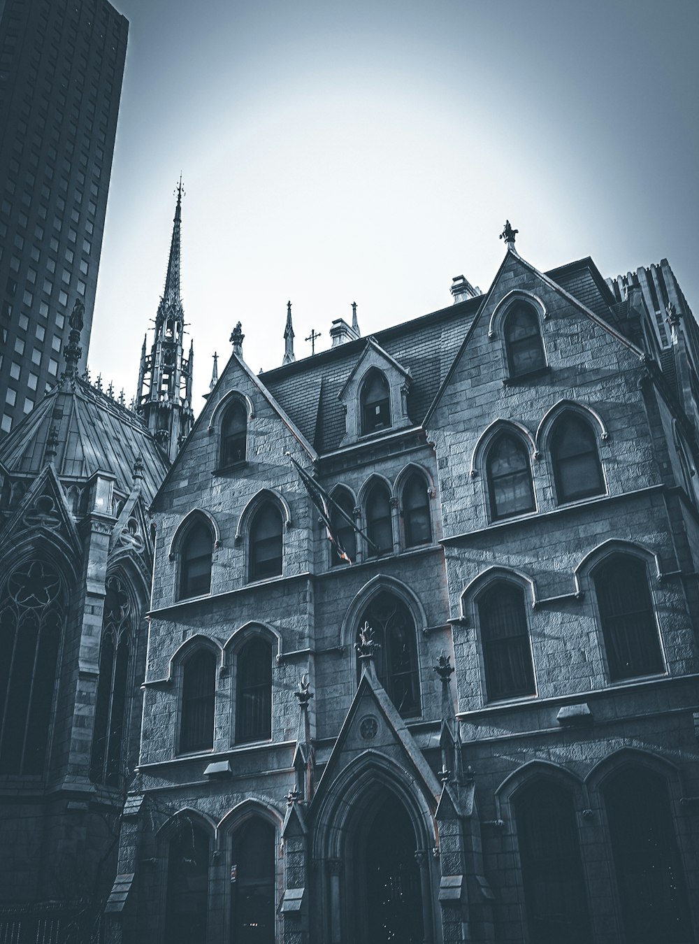 an old church with a steeple and a clock tower