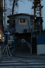 A softly lit construction sign with gentle evening light, symbolizing progress and patience.